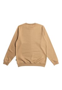 Tan sweatshirt with a smooth texture, ribbed cuffs, and collar. Simple design without patterns. Tag visible near the lower hem.