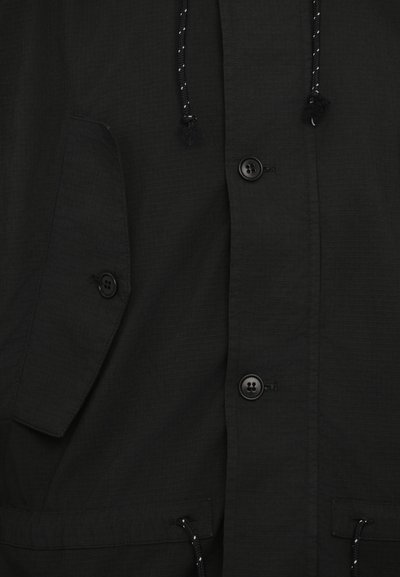 Henrik Vibskov UNCUT SHORT UNISEX - Jachetă parka - black