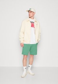 adidas Originals Spodnji deli trenirk - preloved green