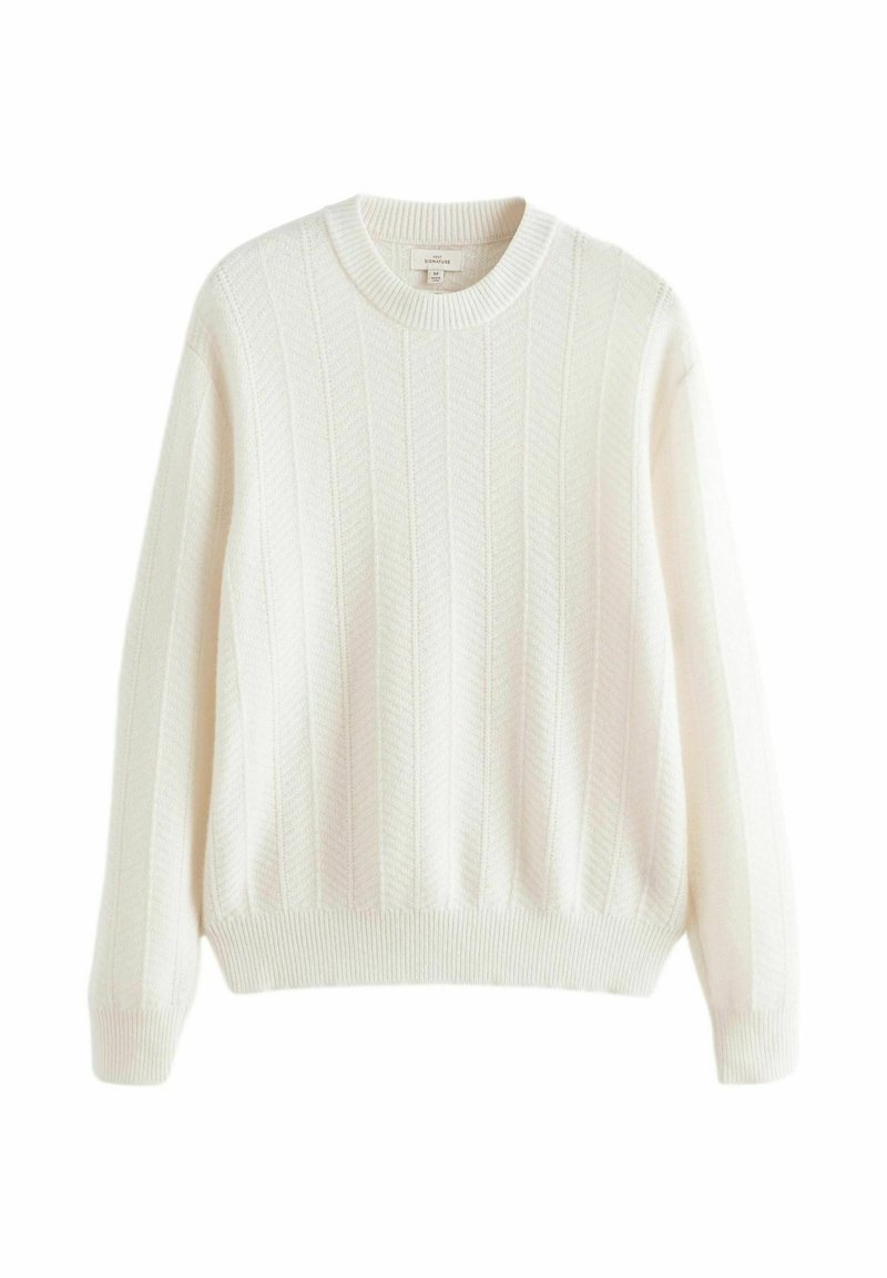 Pull en maille de couleur écru, avec une texture côtelée, un col rond et un motif vertical subtil. Manches longues avec des poignets côtelés.