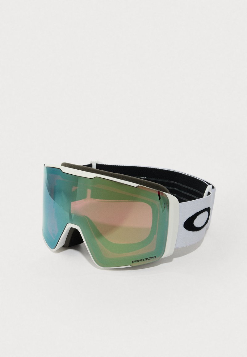 Skibril met een groot, gebogen, spiegelachtig groen en roze glas, een witte plastic montuur en een zwarte verstelbare band met een logo.