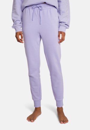 Lilac sweatpants with a drawstring waist, tapered fit, ribbed cuffs, and side panel accents, made from a soft, lightweight fabric.