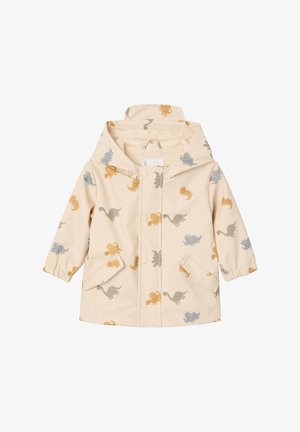Cream-colored children's raincoat with hood, snap buttons, front pockets, and multicolored dinosaur prints in gray, orange, and yellow.