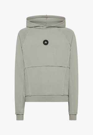 Lichtgrijze hoodie gemaakt van zachte stof. Voorzien van een kangoeroezak, een contrasterend zwart rond logo en geribde boorden en zoom.