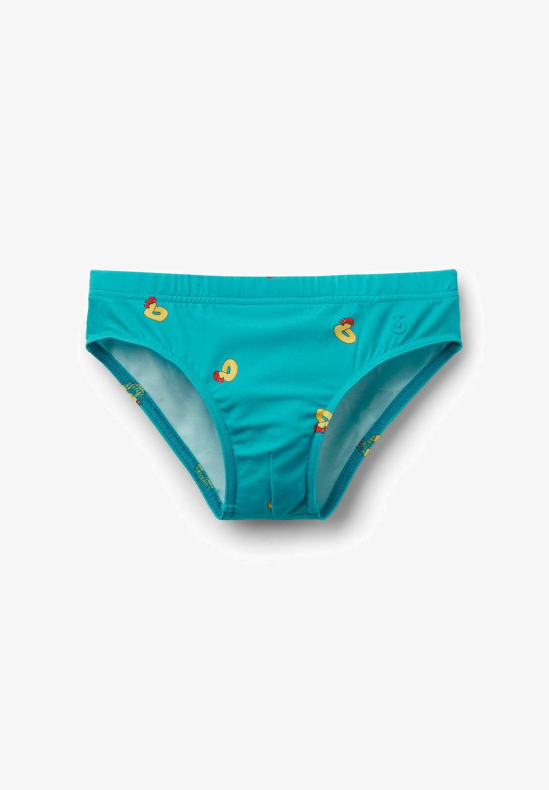 Slip de bain turquoise vif avec de petites imprimés de canards en caoutchouc jaunes portant des nœuds rouges dispersés sur le tissu.