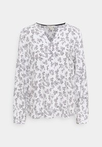 Blusa bianca a maniche lunghe con scollo a V, caratterizzata da un motivo floreale nero, tessuto morbido e polsini con bottoni.
