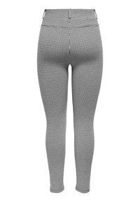 Zwart-wit houndstooth patroon leggings, slim fit, elastische tailleband en een gladde textuur; ontworpen voor een aansluitende silhouet.