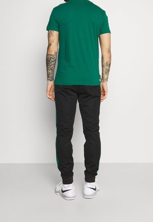 Pantalones deportivos - black