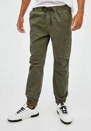 INSIDE Pantalones deportivos - verde