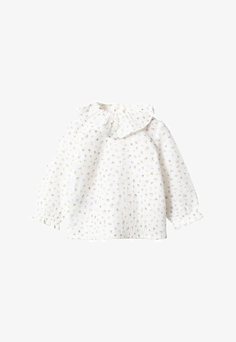 Blouse blanche pour bébé à manches longues avec petit imprimé floral, col volanté et poignets élastiques.