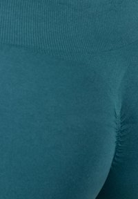 Türkise Leggings mit einer glatten, elastischen Textur. Der hoch geschnittene Stil verfügt über eine gerippte Detailierung am Bund und konturierte Nähte.