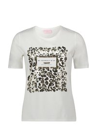 Hvid bomulds T-shirt med et leopardmønster i sort og guld. Centeret tekstpatch med teksten "VÆR DIG SELV N°34." Korte ærmer og rund hals.