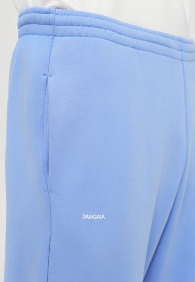 Light blue sweatpants made of soft fabric, featuring a drawstring waist, side pockets, and a white "PANGAIA" logo on the front.