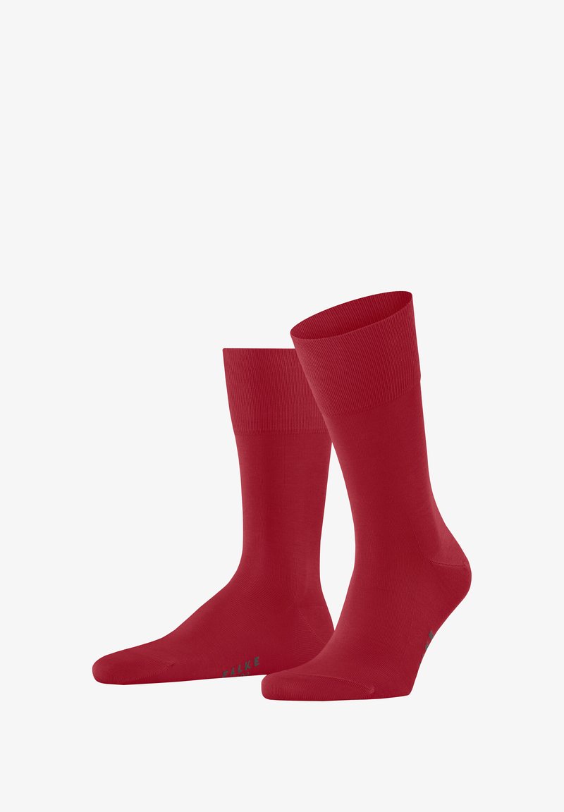 Rote Baumwollsocken mit glatter Textur, geripptem Bündchen und verstärkter Zehenpartie. Minimalistisches Design mit einem dezenten Logo-Detail in Grün.