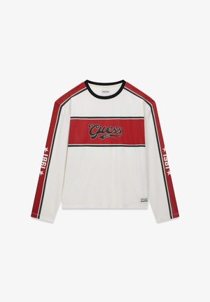 Hosszú ujjú fehér hálós ing piros díszítéssel és fekete csíkokkal. Közepén "Guess Jeans" logóval és sportos kialakítással.