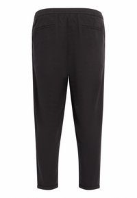 Pantalon noir à texture lisse, taille élastique et deux poches arrière. Jambes fuselées avec revers aux chevilles.
