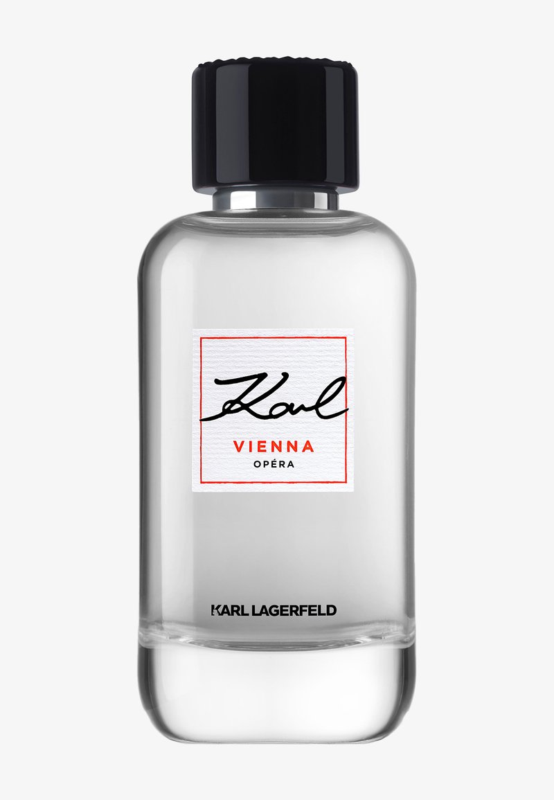 Clear glass perfume bottle with black cap, labeled "Karl Vienna Opéra" and "Karl Lagerfeld" at the bottom.