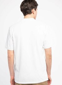 White short-sleeve t-shirt from the back, featuring a crew neckline and a relaxed fit. Soft cotton fabric with no visible patterns or accents.