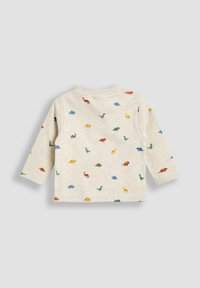 Langes, hellbeiges Langarmshirt mit einem Dinosaurier-Muster in verschiedenen Farben, runder Ausschnitt und weicher Textur.