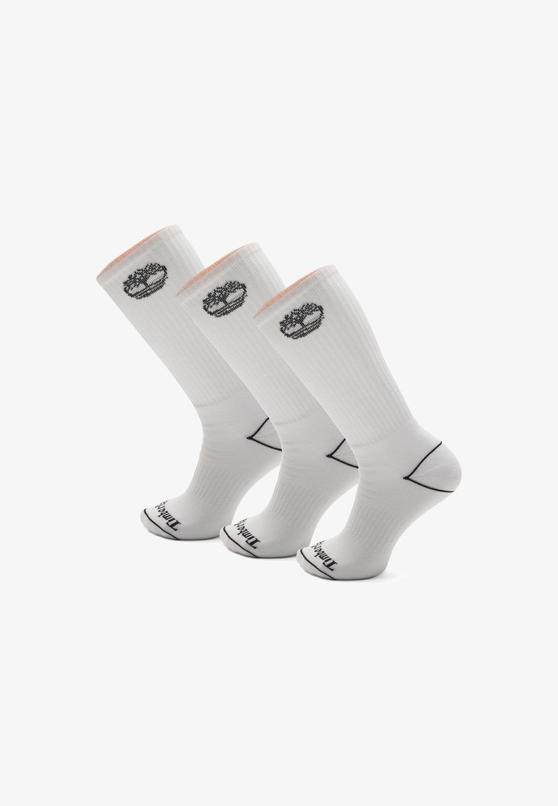Hvide træningsstrømper i et sæt af tre, med ribbet tekstur, kontrasterende sort logo og farveaccentuationer på manchetterne.