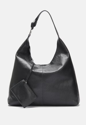 Black leather shoulder bag with a long strap and attached small zippered pouch, shown against a plain light background.