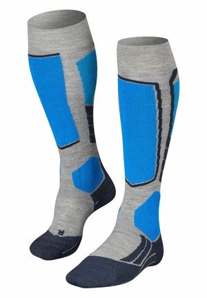 Kniehoge sokken, grijs met blauwe accenten en textuurpatronen. Beschikbaar met versterkte hiel en tenen, en een contrasterende donkerblauwe voetsectie.