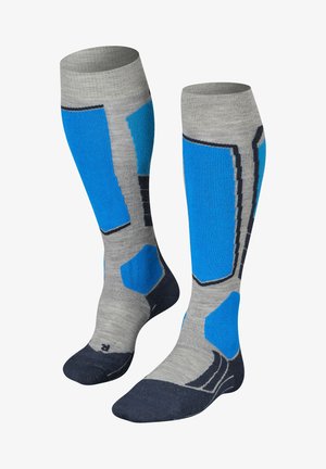 Kniehoge sokken, grijs met blauwe accenten en textuurpatronen. Beschikbaar met versterkte hiel en tenen, en een contrasterende donkerblauwe voetsectie.