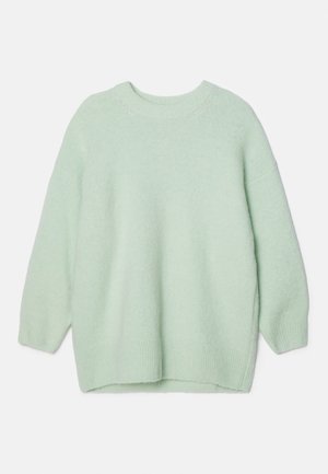 Šviesiai žalia, per didelis megztinis, pagamintas iš minkštos mezginio medžiagos. Turi apvalų iškirpimą, ilgas rankoves ir šonkauliuotą apatinę dalį su šoniniais plyšiais.