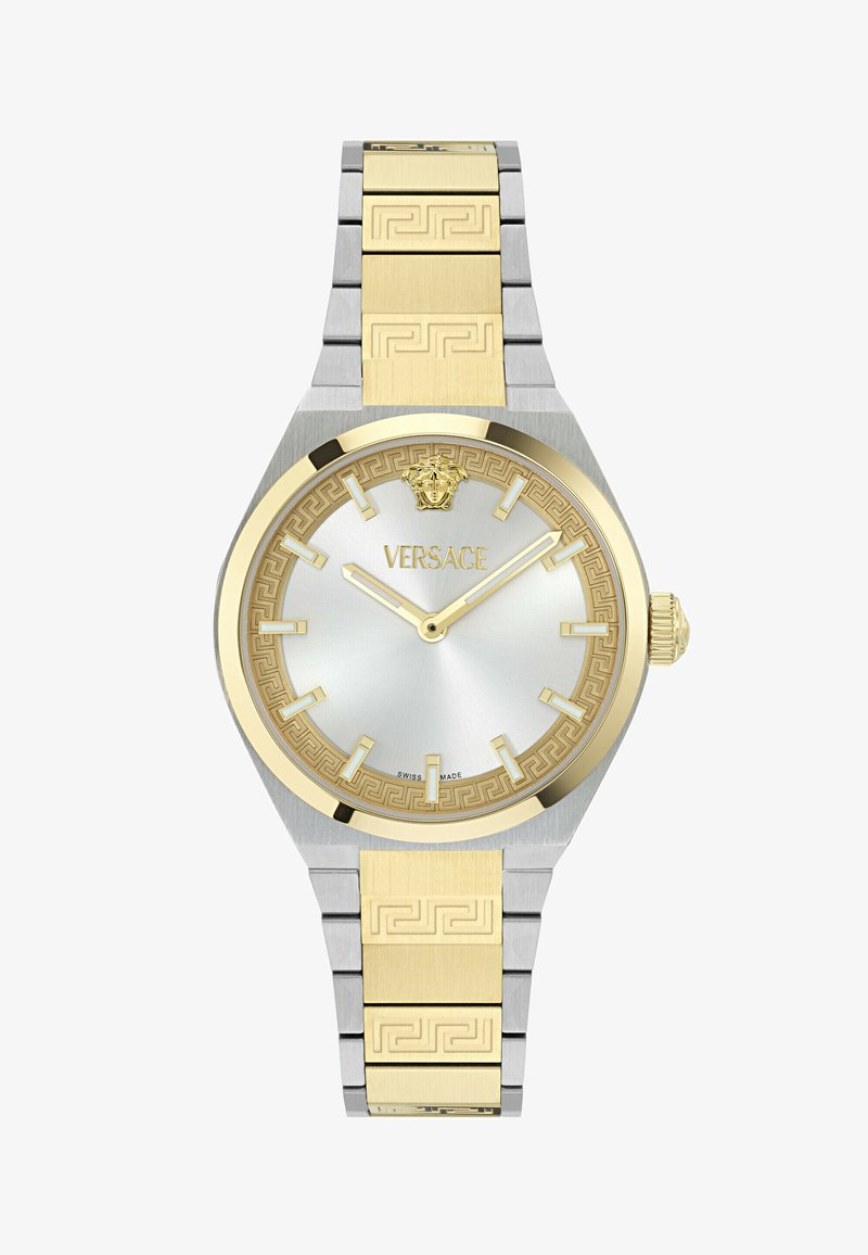 Montre-bracelet Versace avec bracelet en métal or et argent, lunette en or, cadran argenté, index des heures en or, et logo Méduse à 12 heures.