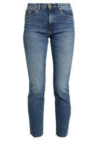 Höga slim-fit jeans i medelblå denim. Har framfickor, dragkedja och urtvättad detaljering på låren.