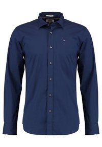 Camicia blu navy con bottoni, maniche lunghe, realizzata in tessuto morbido, con un piccolo logo sul petto e design del colletto standard.