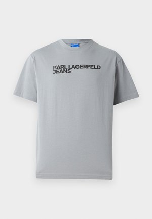 Gray cotton t-shirt featuring short sleeves and a crew neckline. Black text reading "KARL LAGERFELD JEANS" across the front.