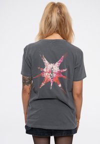 Gray cotton t-shirt featuring a vibrant graphic design with a starburst pattern in pink and orange on the back, short sleeves, and relaxed fit.