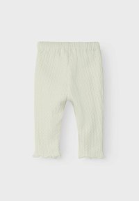 Lichtgroene geribde leggings met een elastische tailleband en gegolfde zomen, met een getextureerd stofpatroon.