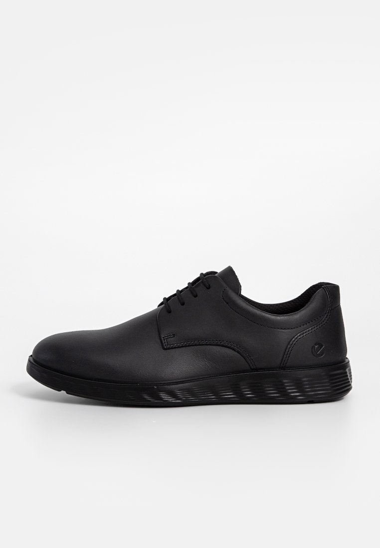 Black leather shoes with a smooth finish, lace-up design, rounded toe, and a textured rubber sole. Minimal detailing and sleek silhouette.