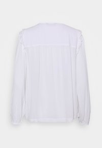 Blusa bianca a maniche lunghe con dettagli arricciati, tessuto morbido e vestibilità ampia con pieghe sul retro.