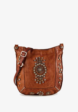 Brown leather shoulder bag with adjustable strap and decorative circular metal studs arranged in floral patterns on front and sides.