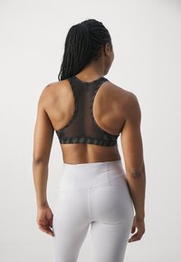Puma - Stanik sportowy z średnim wsparciem
