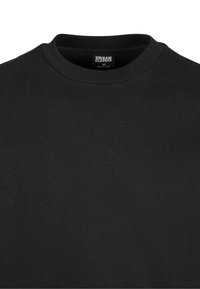 Schwarzer Sweatshirt mit rundem Halsausschnitt, aus Baumwolle gefertigt. Verfügt über eine weiche Textur und ein Urban Classics-Label im Kragen.