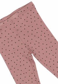 Roze geribbelde leggings met kleine zwarte hartpatronen verspreid over het geheel. Rekbare tailleband voor comfort en een aansluitend ontwerp.