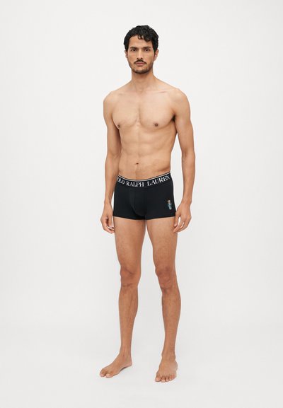 Black boxer briefs with white waistband featuring "POLO RALPH LAUREN" text and a small colorful embroidered bear logo on the side.