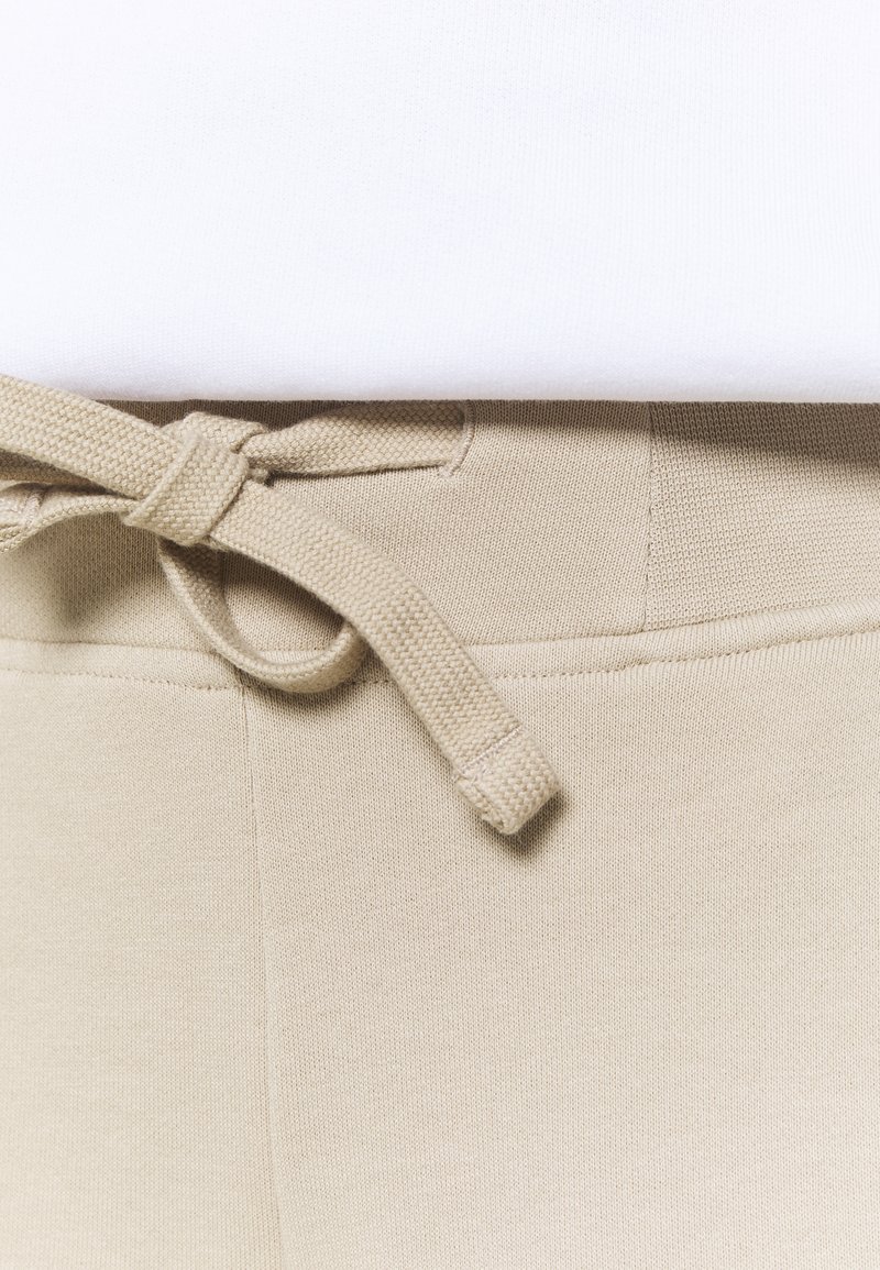 Damen Sportbekleidung | Peak Performance ORIGINAL LIGHT WIDE Stoffhose celsian beige/beige - EO90592 Damen Sportbekleidung | Peak Performance ORIGINAL LIGHT WIDE Stoffhose celsian beige/beige - EO90592
