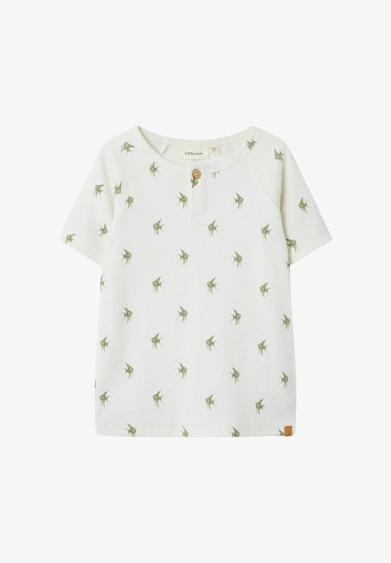 White ribbed short-sleeve T-shirt with a round neckline, featuring a green leaf pattern and a wooden button detail at the neck.