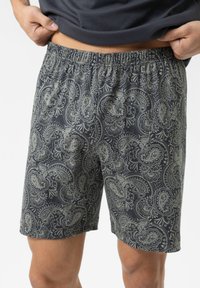 Navy blue shorts with elastic waistband, featuring a light paisley pattern and smooth fabric texture, reaching just above the knee.