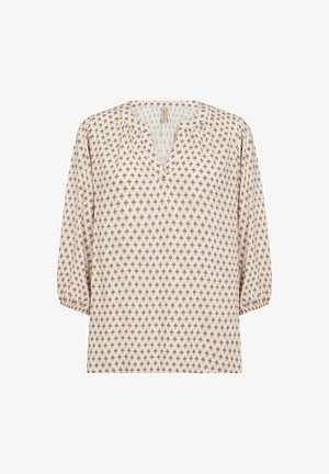 Lightweight, cream blouse with a V-neck, three-quarter puff sleeves, and a repeating diamond pattern in rust. Soft fabric texture.