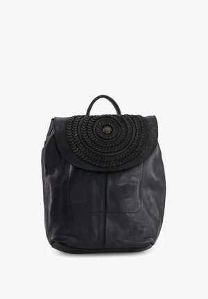 Black leather backpack with a textured circular design on the flap, featuring a top handle and adjustable straps for carrying.
