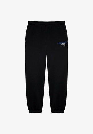 Czarne spodnie dresowe wykonane z gładkiego materiału z elastycznym paskiem w talii i ściągaczami. Z lewej strony uda posiadają niebieskie graficzne detale.