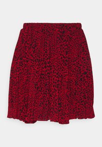 Rote裙Mädchen mit einem schwarzen Leopardenmuster, elastischem Bund und ausgestellter Silhouette. Aus leichtem, fließendem Stoff gefertigt.