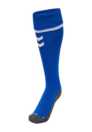 Blå sportsok med ribbet top, hvid stribe og tekstureret grå sål. Har en glat finish og tre dekorative hvide chevronmønstre.