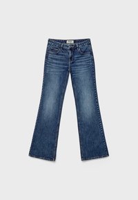 Flared blue denim jeans with a faded wash, five-pocket design, and stitched detailing along the seams.